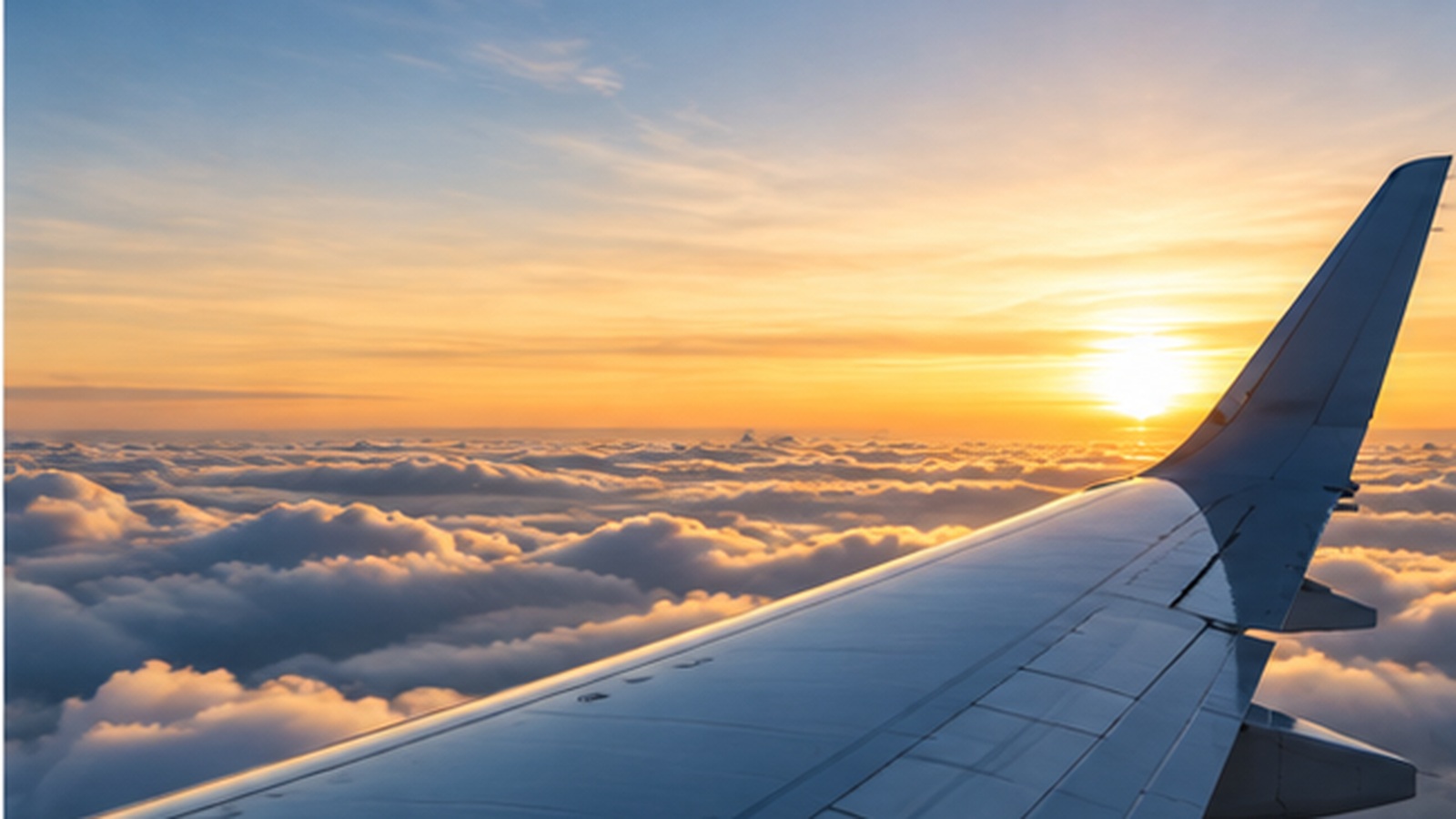 Aircraft wing above clouds